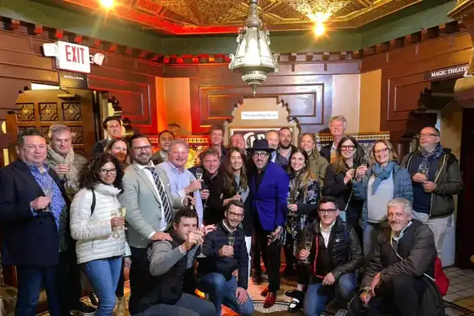 Group toast with champagne at Marrakech Magic Theater